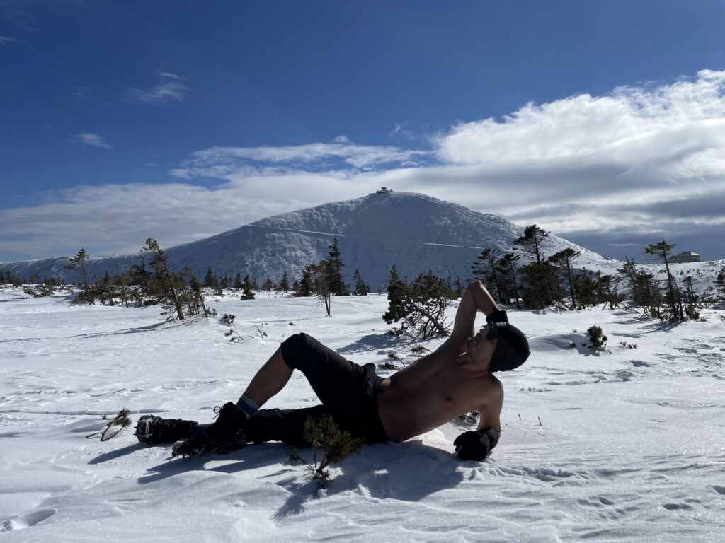 Climbing a cold mountain in shorts
